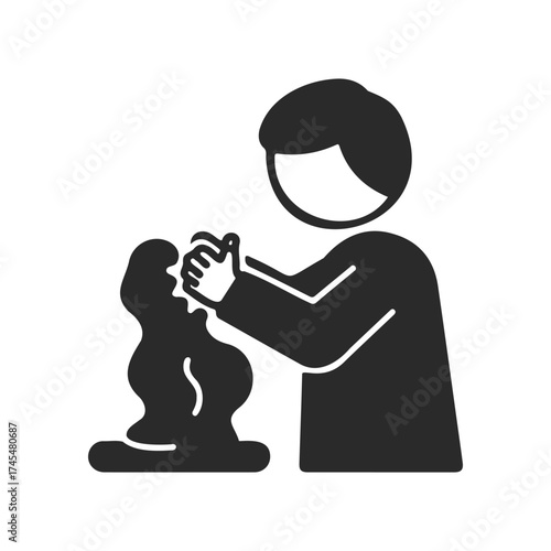 Silhouette of person sculpting clay with hands in black and white icon design