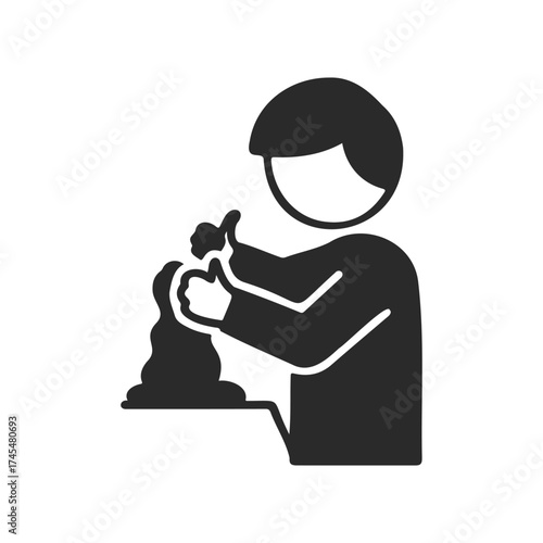 Silhouette of asian male child sculpting clay with thumbs up