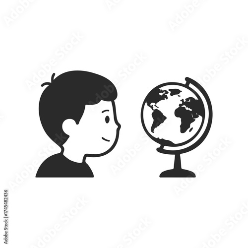 Child exploring globe: young male engages in geography learning adventure