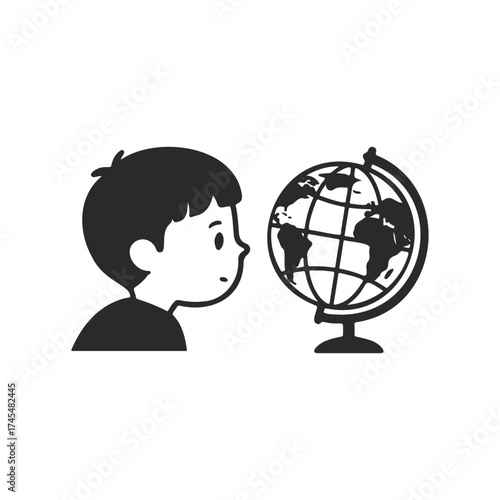 Curious child exploring globe: young male engaged with world geography