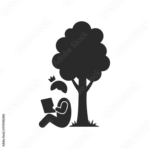 Silhouette of person reading under tree with crown