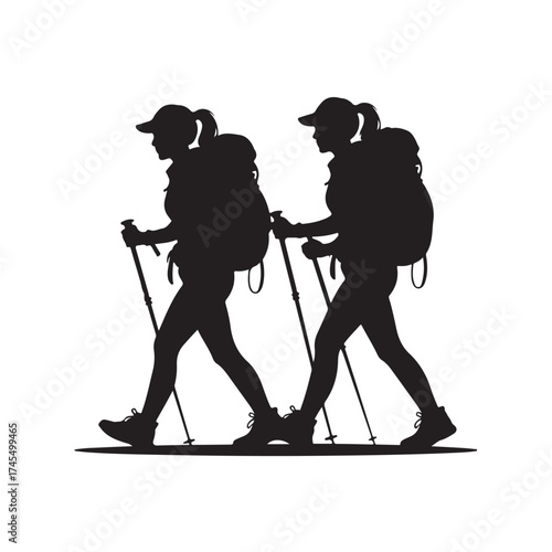 Two hikers with backpacks and trekking poles walking side by side silhouette