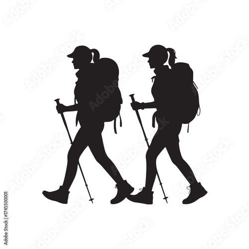 Two hikers with backpacks and trekking poles walking side by side silhouette