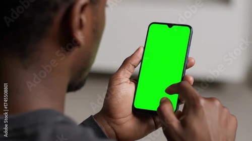 Wallpaper Mural Man Using Smartphone with Green Screen for Visual Effect Placement Torontodigital.ca