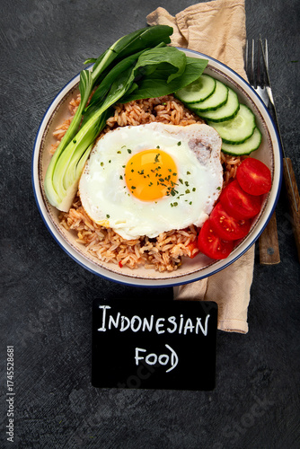 ndonesian nasi goreng (fried rice) served on a plate.