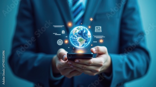Wallpaper Mural Businessman holding a smartphone with a futuristic digital globe and icons Torontodigital.ca