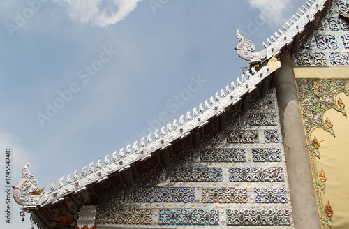 Carved gold roof of church in Wat Sridonmoon, Chiang Mai Province, Northern Thailand.