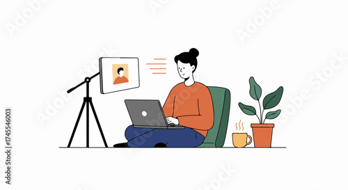 Person working remotely on laptop, engaged in an online video conference from a cozy home office setup, with a steaming mug and a plant.