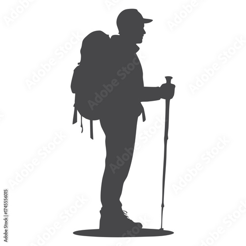 Silhouette of a hiker with a backpack and trekking pole