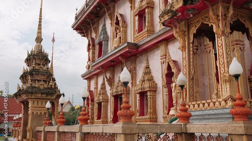 Ornate details of wat chalong buddhist temple exterior in Phuket, Thailand, showcasing traditional thai architecture.