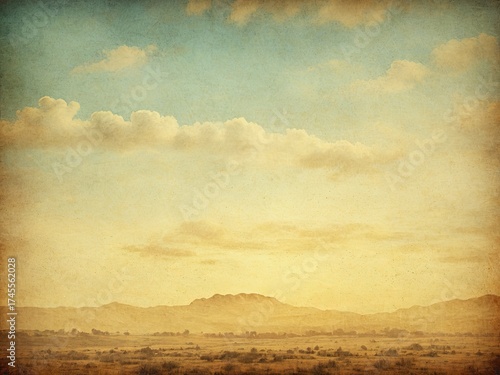 Vintage landscape scene with mountains under a cloudy sky