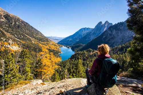 Wallpaper Mural Young hiker woman in autumn in Aiguestortes and Sant Maurici National Park, Spain Torontodigital.ca