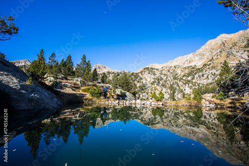 Wallpaper Mural Young hiker woman in autumn in Aiguestortes and Sant Maurici National Park, Spain Torontodigital.ca
