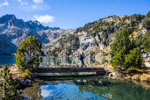 Wallpaper Mural Young hiker woman in autumn in Aiguestortes and Sant Maurici National Park, Spain Torontodigital.ca