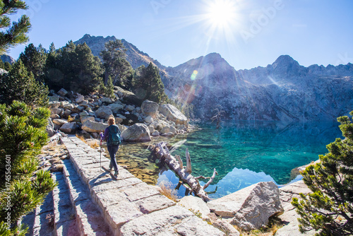 Wallpaper Mural Young hiker woman in autumn in Aiguestortes and Sant Maurici National Park, Spain Torontodigital.ca