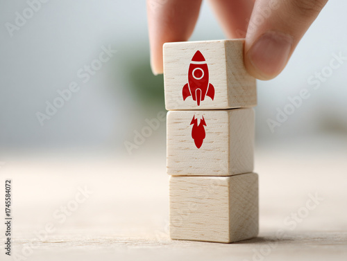 Hand holding a wooden sign