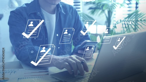 Human resources manager using recruitment technology and digital tools for candidate selection and hiring approval.