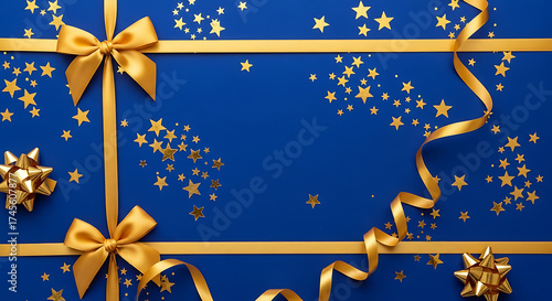 Golden bows and ribbons on blue, festive background, luxury holiday decoration with copy space