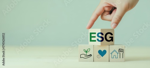 ESG Initiative: A hand carefully places an ESG block atop symbols representing environment, social, and governance principles. Emphasizing sustainability and ethical values.