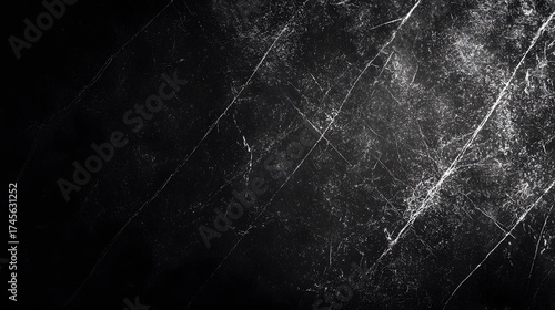 Dark abstract background with white scratches and grunge texture.