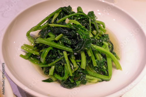 Close-up of garlic spinach, Stir-Fried Water Spinach and Garlic. Food and vegetable concept.