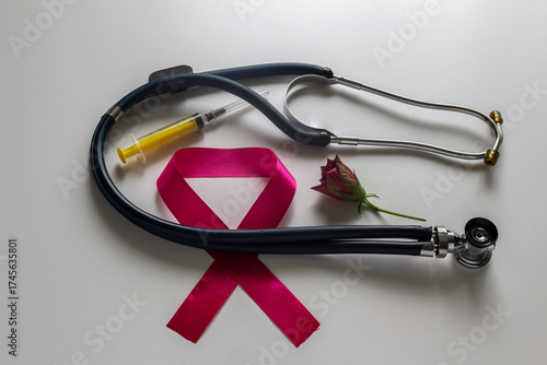 Emblem for World AIDS Day, stethoscope, syringe, rose. On a white background.