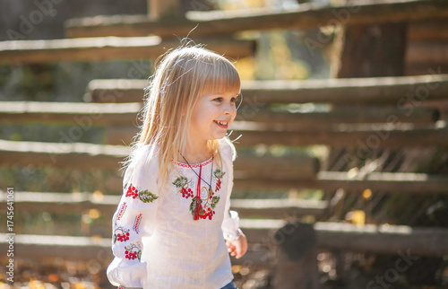 Girl Enjoying the Beauty of Autumn During a Playful Day Outdoors in a Scenic Park in October, Celebrating Halloween With Vibrant Fall Colors