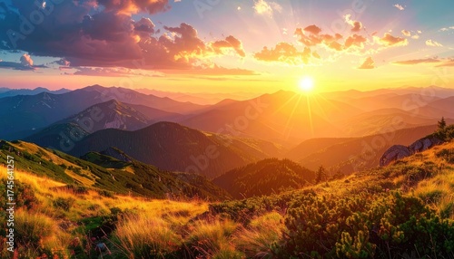 Fototapeta Naklejka Na Ścianę i Meble -  Majestic sunset over mountain range, golden light, dramatic sky