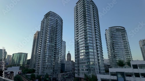 Modern High-Rise Buildings and Vancouver City Skyline Against a Clear Blue Sky