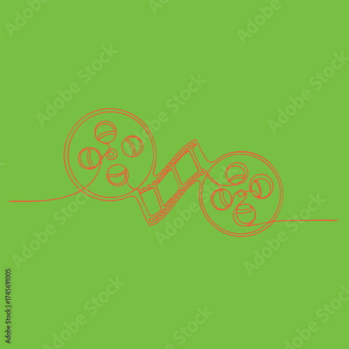 Colorful film reels and strip on vibrant green representing cinema and filmmaking arts