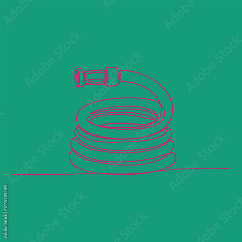 Coiled garden hose with spray nozzle on a vibrant , emphasizing outdoor watering equipment and flexible tubing