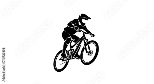 Silhouette of a mountain biker mid-air, demonstrating skillful cycling technique.