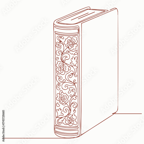 Ornate decorative hardcover book standing upright with intricate floral patterns on the spine and a minimalist design on the cover