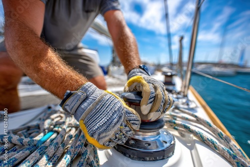 Sailor skillfully adjusts rudder system while sailing on sunny day