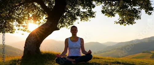 Woman meditating under a tree at dawn practicing mindfulness and connecting with nature for