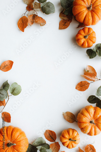 Autumn pumpkins and leaves border seasonal flat lay arrangement perfect for Thanksgiving and fall-themed designs
