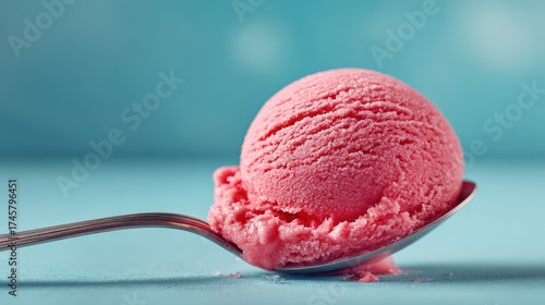 Delicious Pink Strawberry Ice Cream on a Silver Spoon