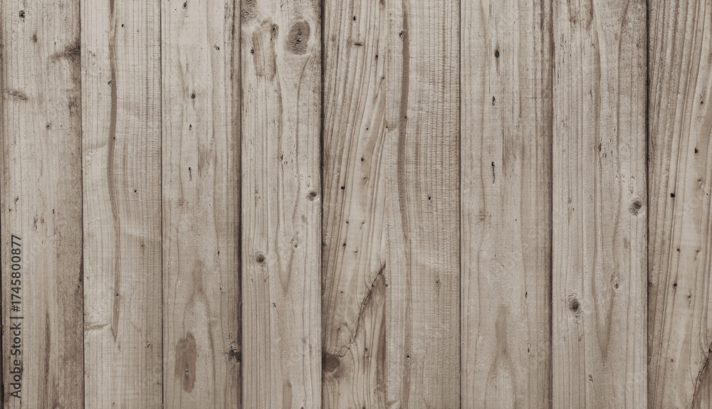 Fototapeta premium Weathered gray wooden fence suitable for rustic, rural, or vintagethemed designs in need of texture and character inspiration.