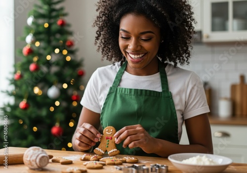 woman decorating gingerbread cookie in festive kitchen during christmas holiday season