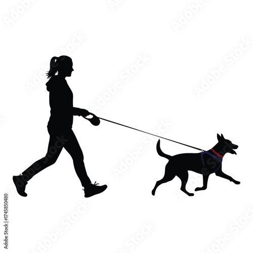 A woman walking her dog on a leash striking silhouette