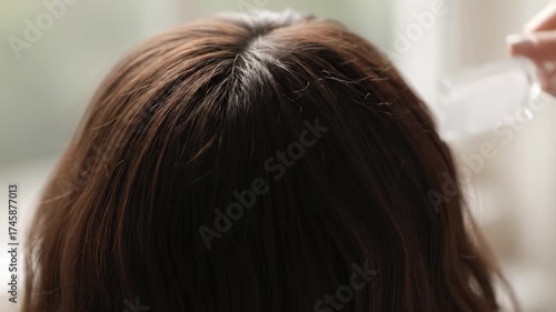 Woman combing hair video overhead view haircare routine grooming footage