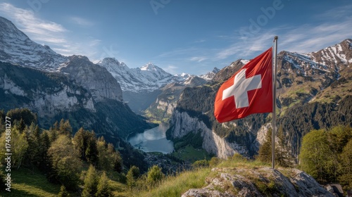 Scenic view of the Swiss flag waving amidst the majestic mountains and valley in Switzerland during a clear day