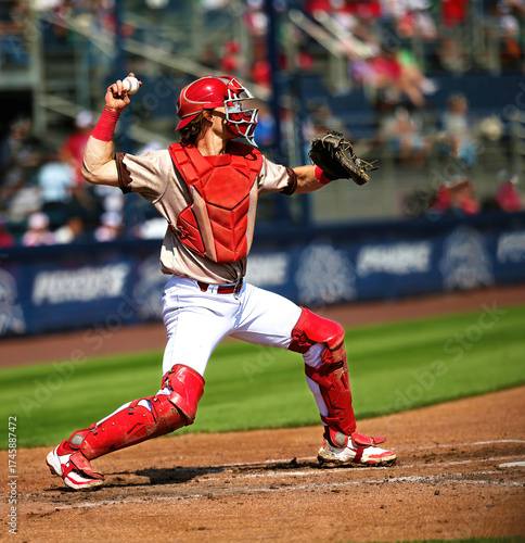 baseball catcher throwing a runner out