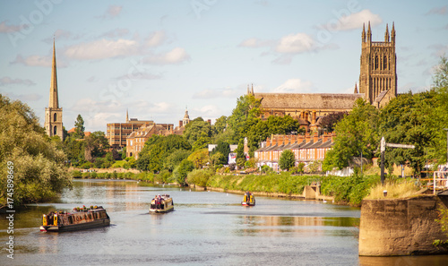 Narrow boats drifting up the River Severn from Diglis Island and locks,at Worcester,England,UK.