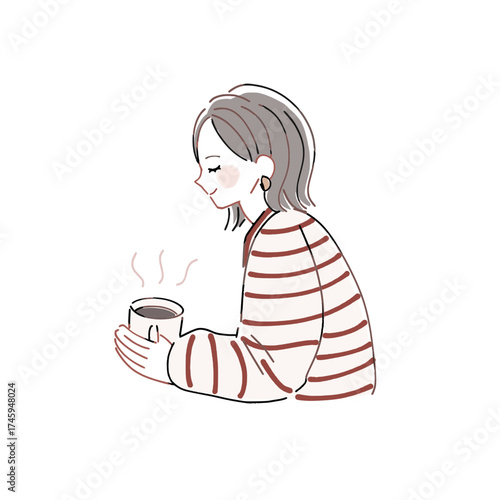 温かい飲み物でひと息ついている女性