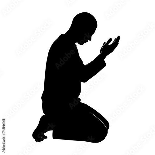 Silhouette of a man kneeling and praying