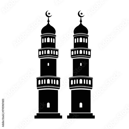 Two black silhouette minarets of a mosque with crescent moon and star on top