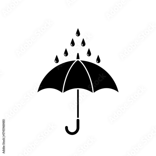 Black silhouette of an umbrella with raindrops falling on it