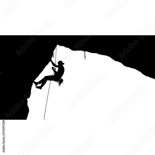 Silhouette of a Rock Climber Rappelling Down a Cliff.