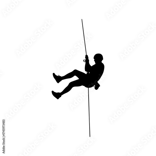 Silhouette of a person rappelling down a rope.